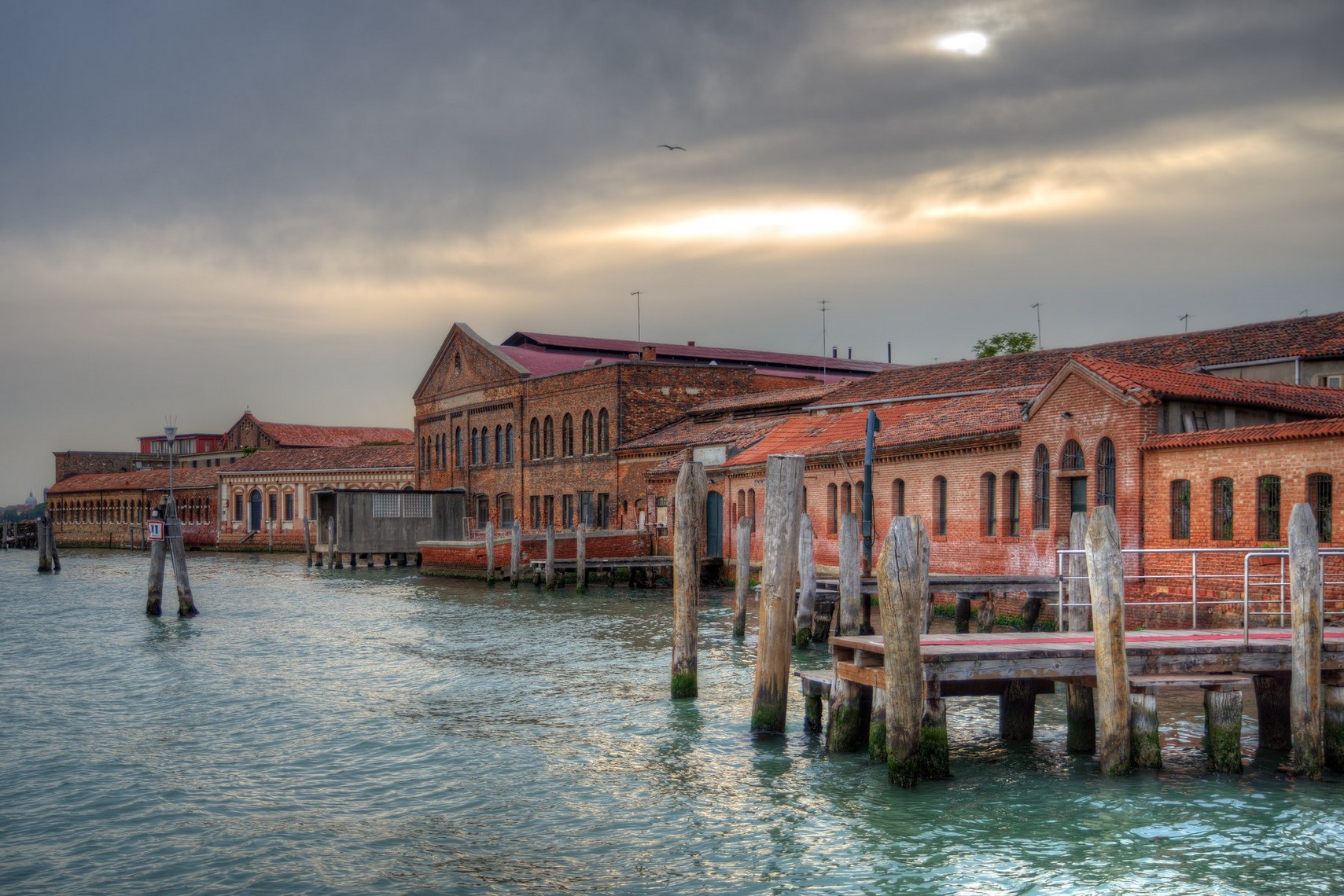 The historic furnaces of Murano along the edge of the lagoon.